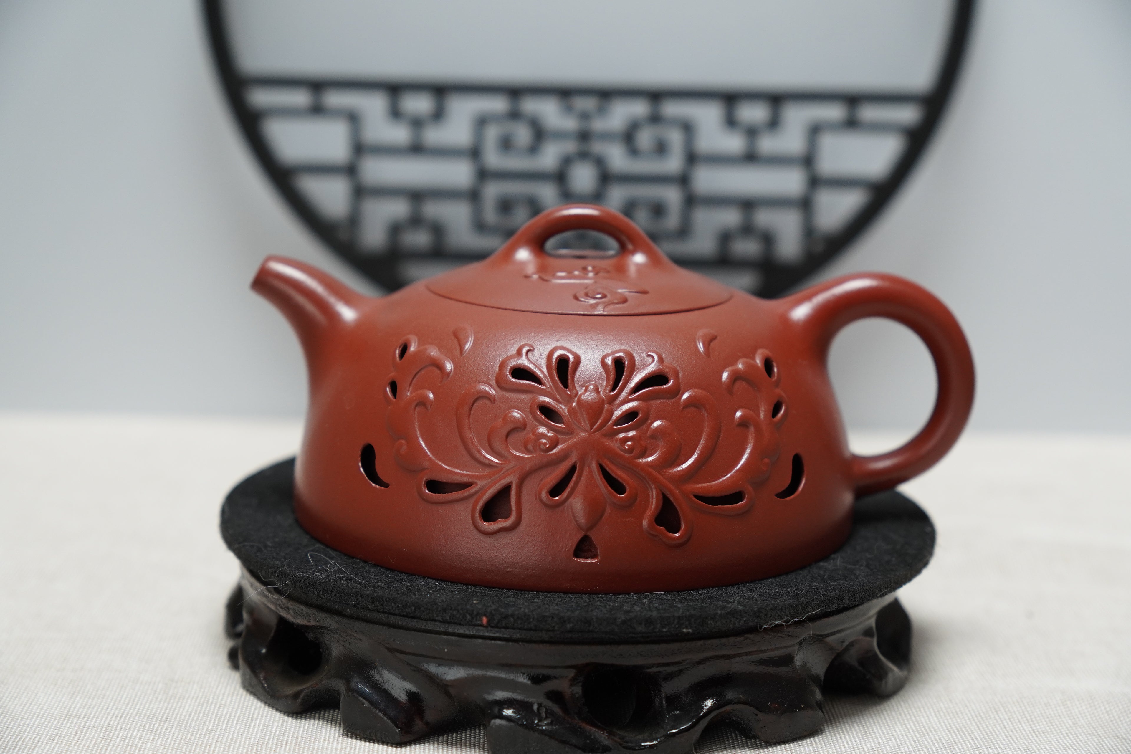 Inner-circulation hollowed-out teapot made of Zisha clay, fully handmade