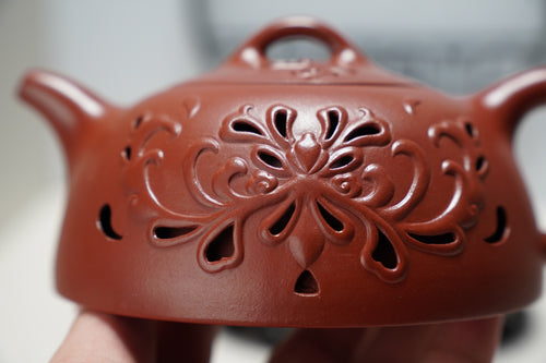 Inner-circulation hollowed-out teapot made of Zisha clay, fully handmade
