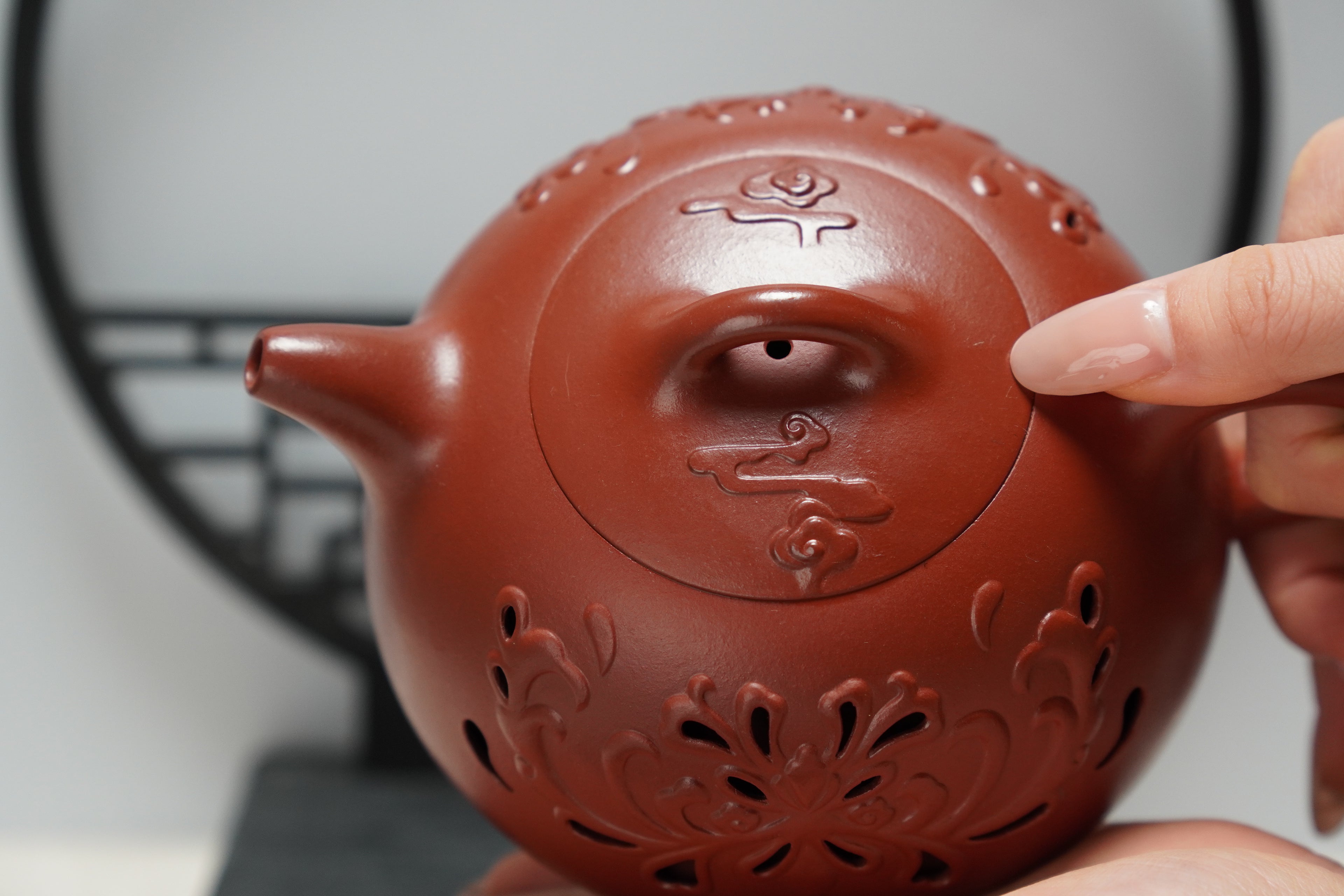 Inner-circulation hollowed-out teapot made of Zisha clay, fully handmade